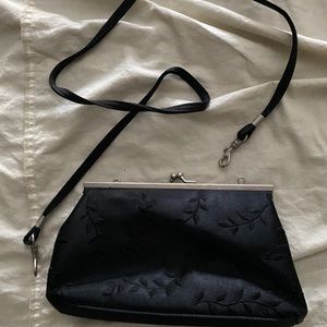 Black Giannini clutch with detachable strap;